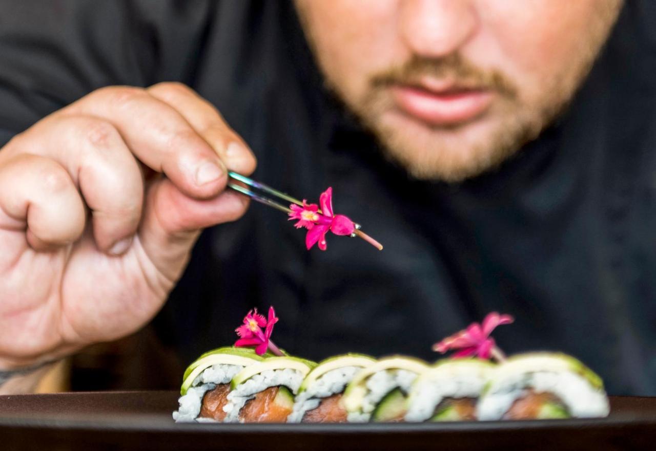 Mitsis Grand Hotel Rhodes City Exterior foto A sushi chef finishing a sushi roll